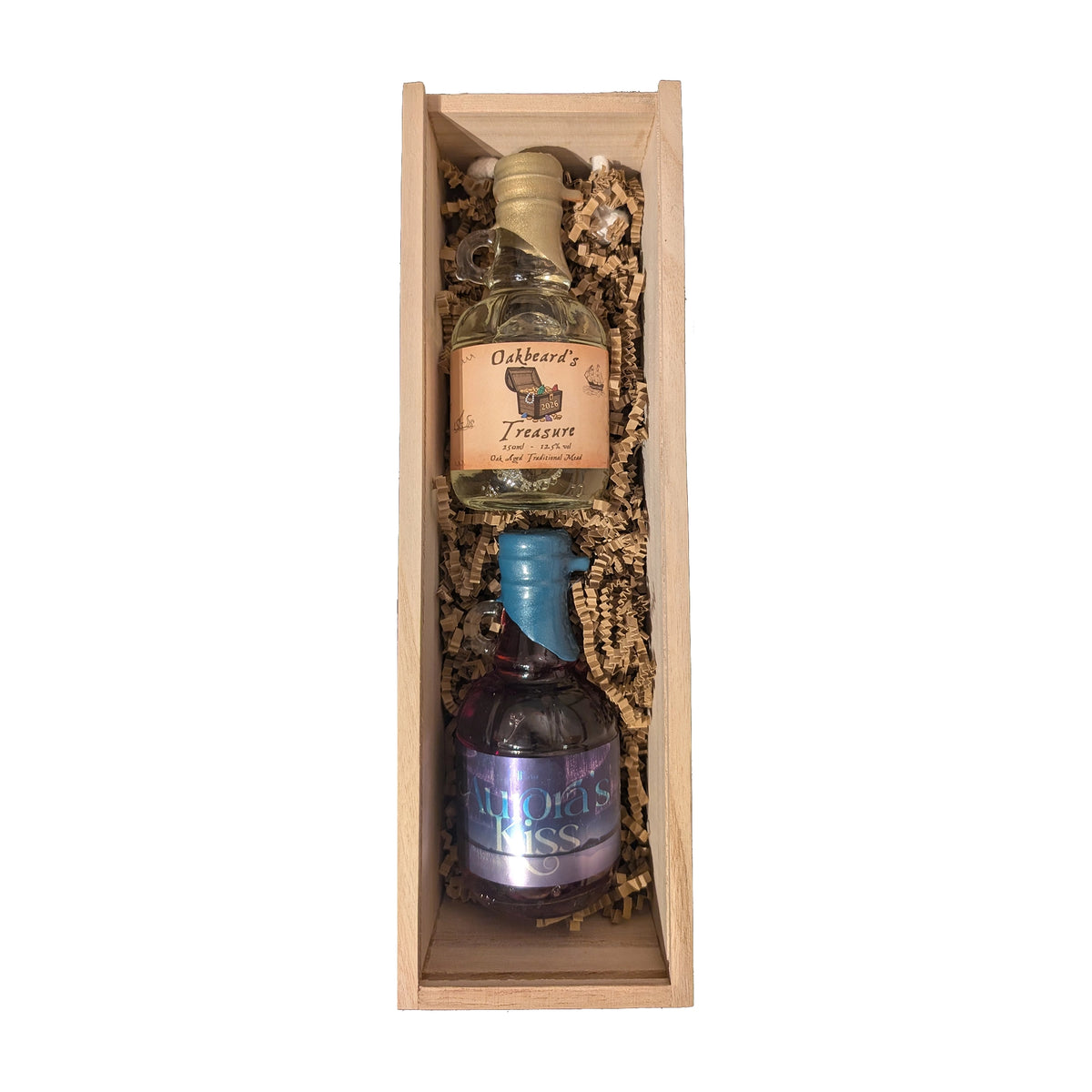 An open gift box containing a 250ml bottle of oak aged mead and a 250ml bottle of blueberry & white chocolate mead.