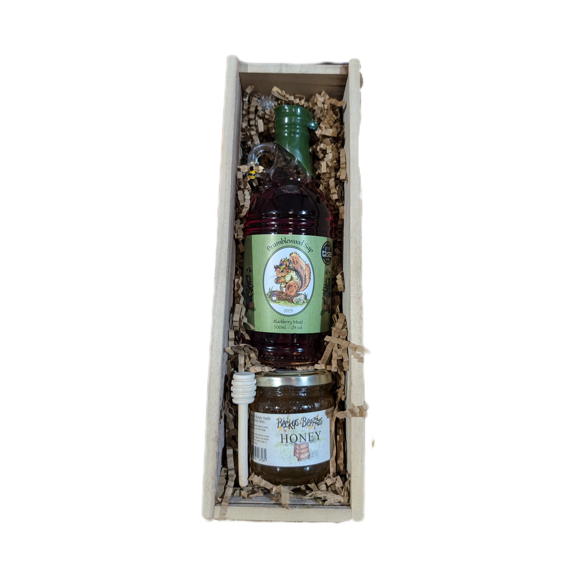 An open gift box containing 500ml blackberry mead, 8oz jar of Hampshire honey, and a honey dipper.