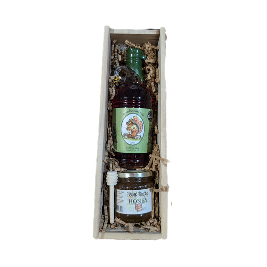 An open gift box containing 500ml blackberry mead, 8oz jar of Hampshire honey, and a honey dipper.