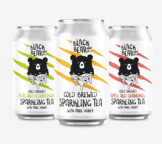 Three cans of Black Bear Honey Co.'s sparkling tea. Just Honey, Pear and Elderflower, and Apple and Chamomile.