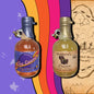 A two mini 250ml bottles mead. The first is a bottle of Oakbeard's Treasure. The second is a bottle of The Cosmo. Each bottle is wax dipped with a label. A small bee charm hangs from the finger handle on the bottles.